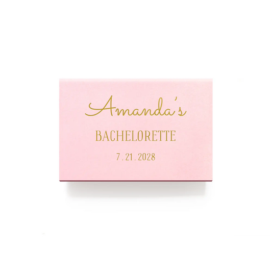 Pink card with gold text 'Amanda's Bachelorette 7.21.2023' on a white background