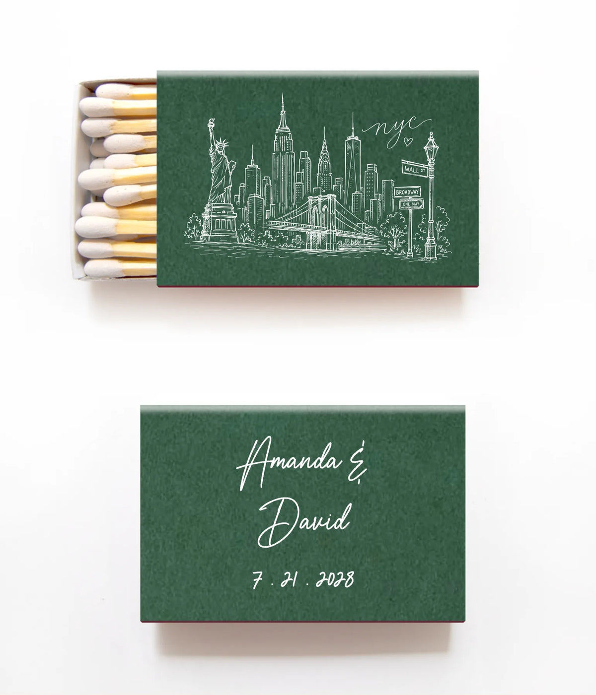 A pair of personalized matchboxes on a white background. The top matchbox is open, showing white match heads and a dark green cover printed with a white New York City skyline illustration and the text 'nyc'.