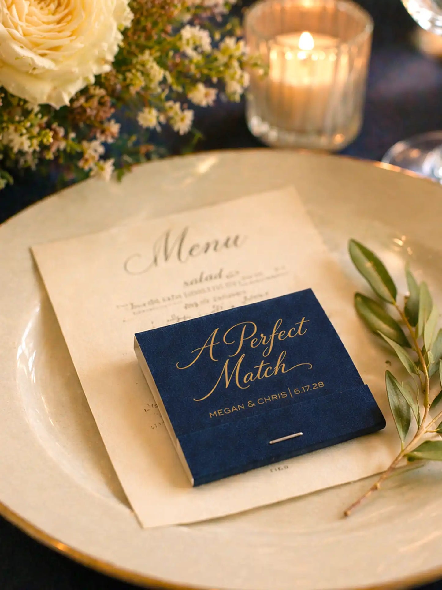 Menu and card on a plate with floral and candle background