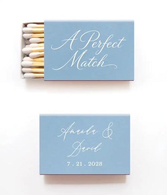 Custom Wedding Dusty Blue Matchbox with 'A Perfect Match' text and personalized details on a white background