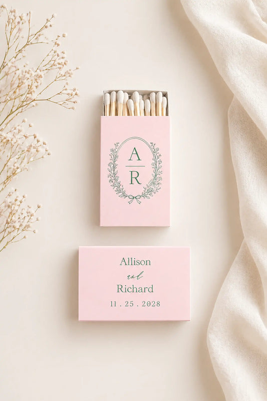 Personalized matchboxes with initials and names on a light background