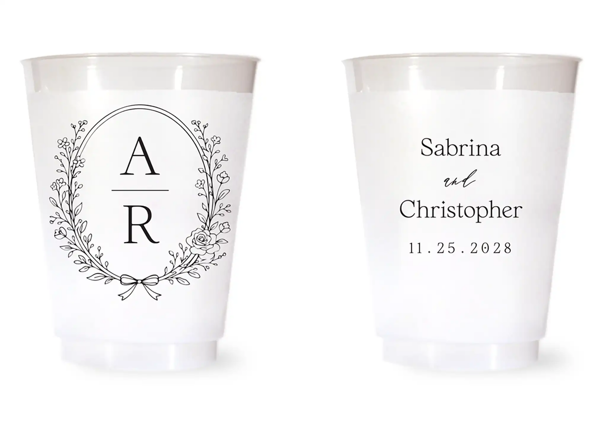 Two white cups with personalized designs on a white background