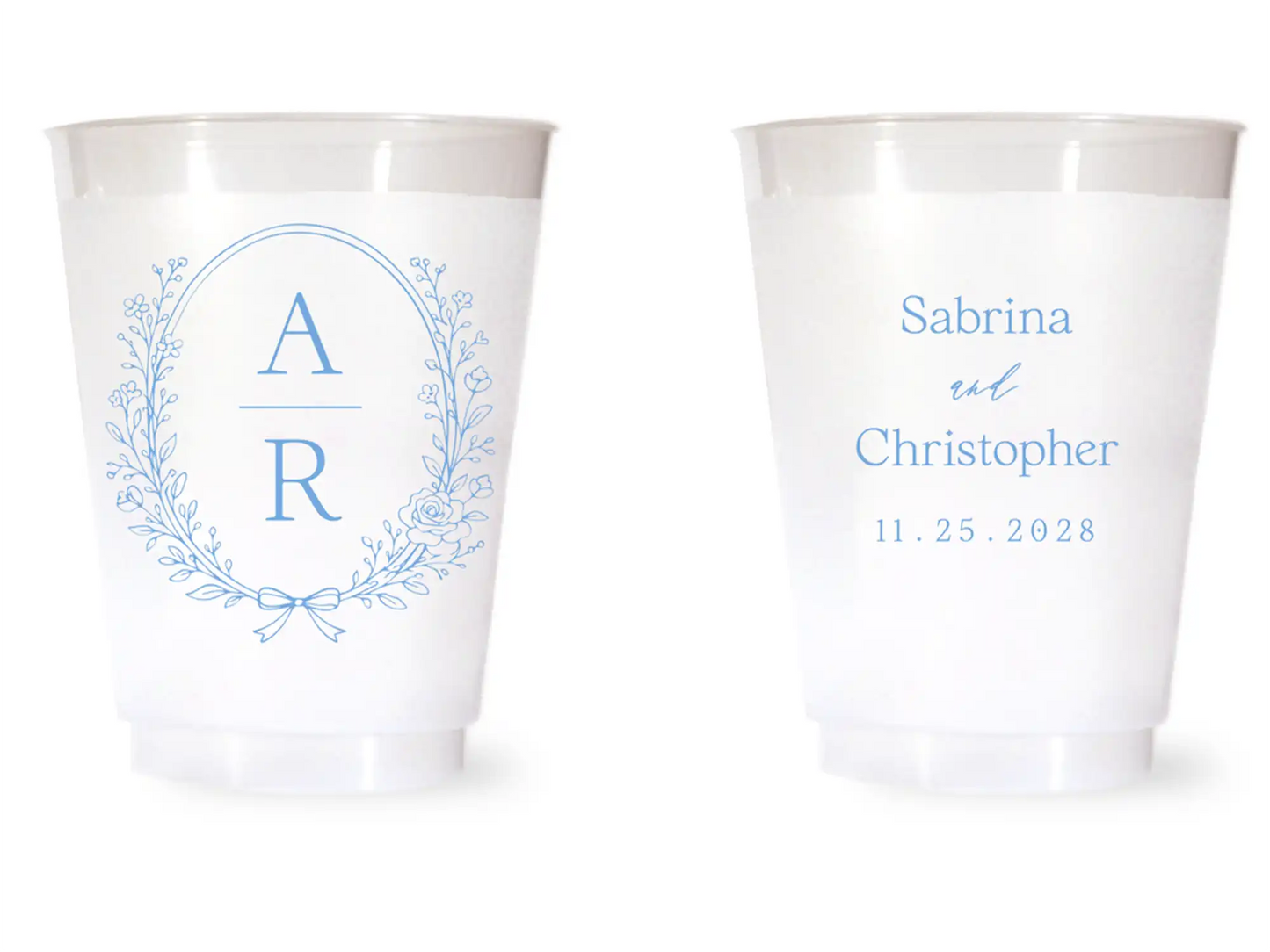 Two white cups with blue monogram and text on a white background