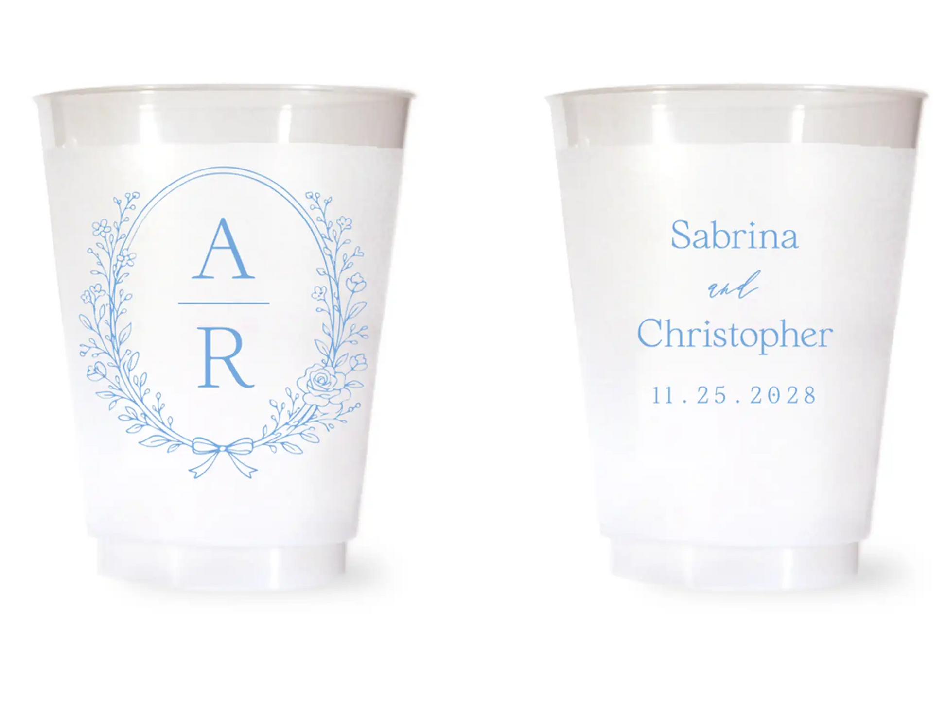 Two white cups with blue monogram and text on a white background