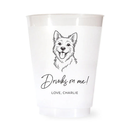 White cup with a black terrier dog illustration and drinks on me love charlie text on a white background