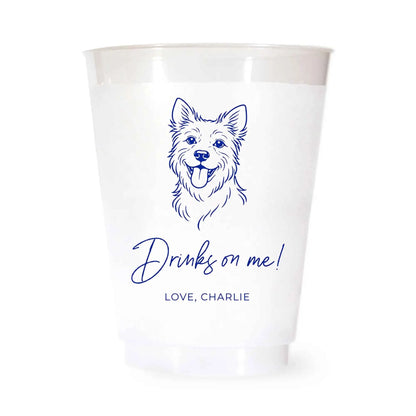 White cup with a blue terrier dog illustration and drinks on me love charlie text on a white background