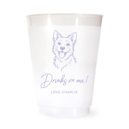 White cup with a purple terrier dog illustration and drinks on me love charlie text on a white background