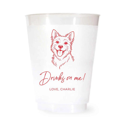 White cup with a terrier dog illustration and drinks on me love charlie text in red on a white background