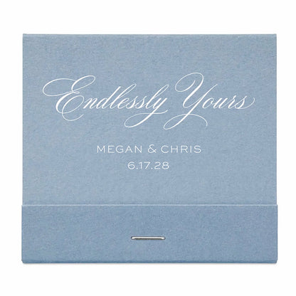 Dusty Blue matchbook with 'Endlessly Yours' and personalized text on a white background