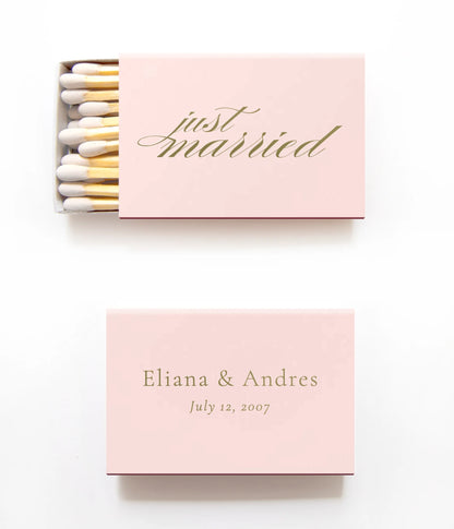 pink matchboxes on a white background that say just married in gold and also have the bride and grooms names and wedding date. 