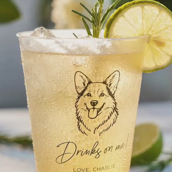 corgi drinks on me custom wedding cup with a yellow drink and lime and rosemary on a table