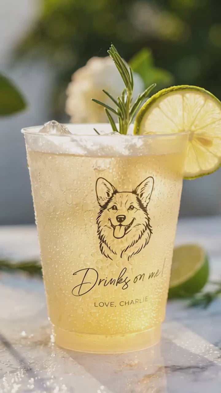 corgi drinks on me custom wedding cup with a yellow drink and lime and rosemary on a table